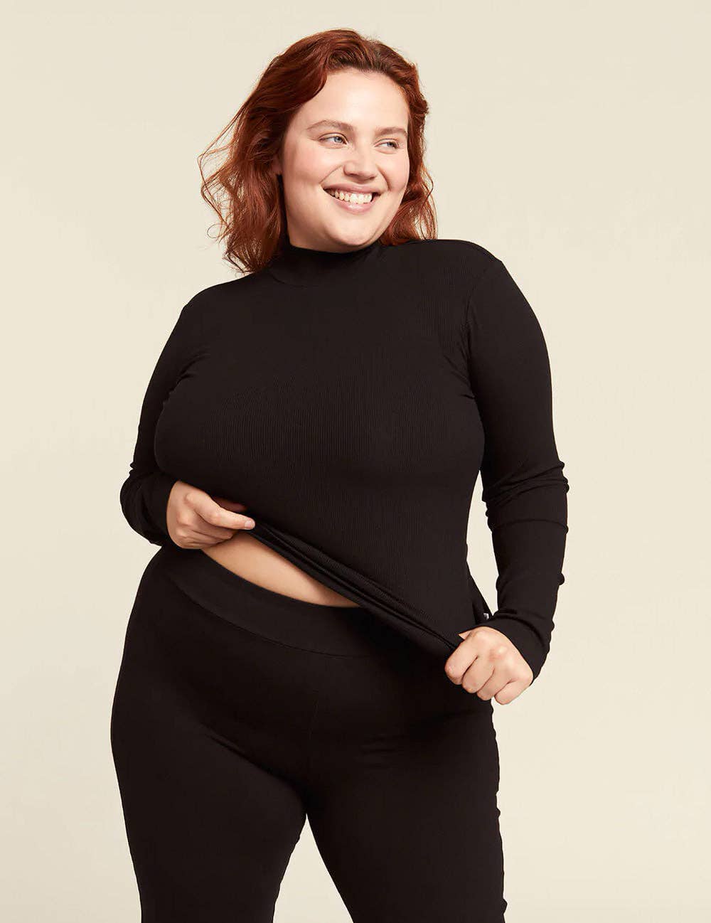 Ribbed Turtleneck Top. in Black