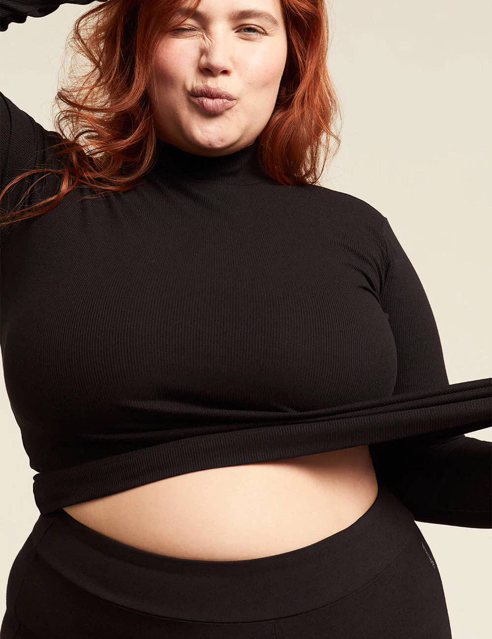 Ribbed Turtleneck Top. in Black